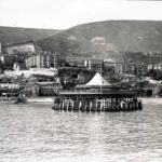 View of Ventnor from the sea with the pier pavilion in the centre foreground