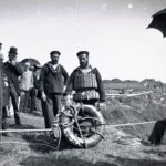 Coastguards at the top of a cliff with life saving apparatus