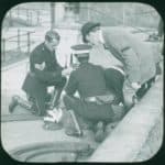 Someone with a head injury being treated on the pavement in Sandown in 1914. Not clear whether this is a real or training incident