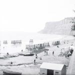 Beach scene with bathing huts at Shanklin