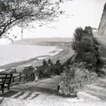 Man walking down the cliff path at Shanklin. and Pier from the cliffs with Culver Cliff in the distance