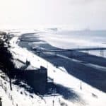 Sandown Bay and Pier from the cliffs with Culver Cliff in the distance and snow lying on the ground