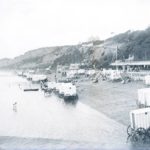 Beach at Sandown with lots of bathing machines