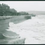 View of Sandown seafront with the waves crashing against the sea wall