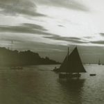 Lone yacht on the water at Cowes at dusk