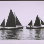 Picture of two lifeboats in calm sea travelling left to right. Left Bembridge Self righting class. ON 676. Langham. Right Barry Dock. Watson motor class. ON 677. Prince David.