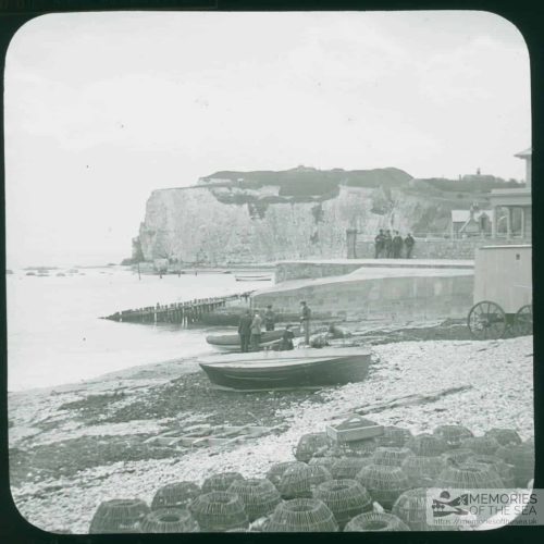 View of Freshwater Gate. Numerous crab pots in the foreground on the beach