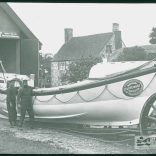 Two crew standing beside the 'Queen Victoria' Bembridge lifeboat