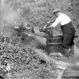 Bert Baker tarring the pots - 1950s