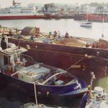 Tug Hofland and barge Kathleen May pausing at Cowes